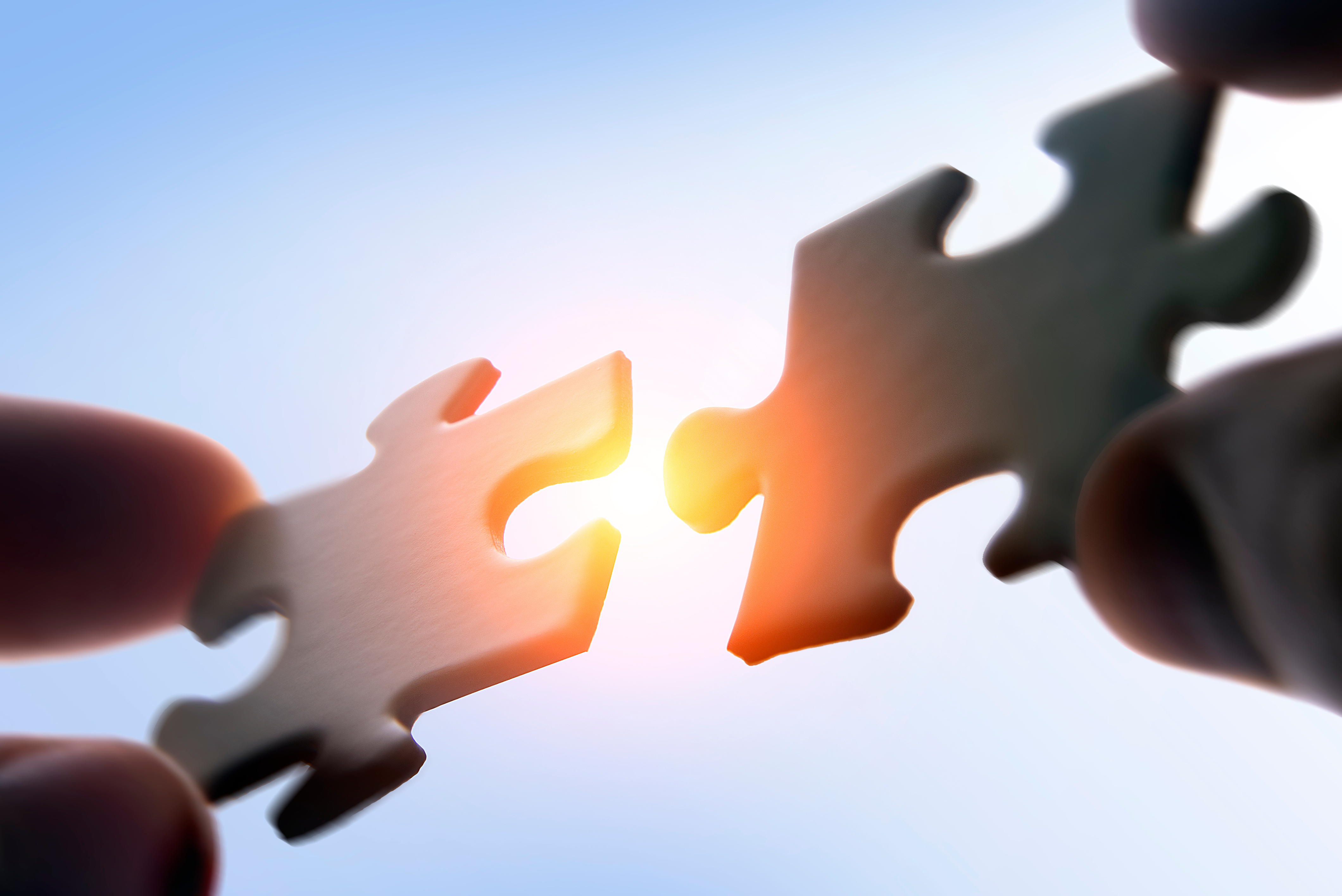Two puzzle pieces connecting together